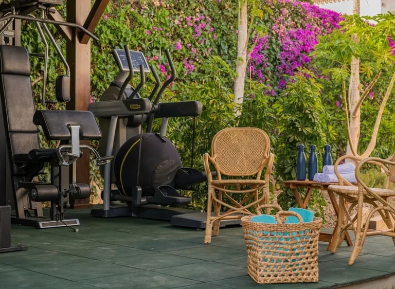 Outdoor gym amid tropical gardens at Villa El Olivo, Marbe