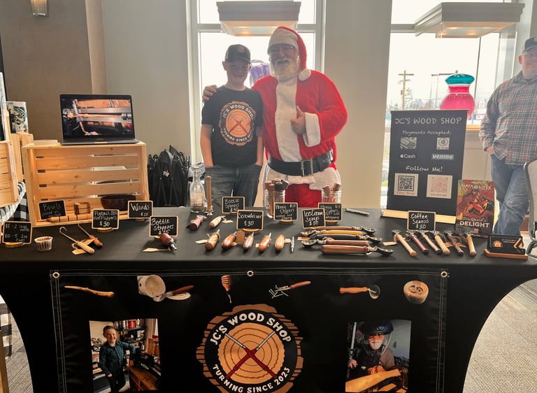 Jackson with Santa Claus at a Christmas craft fair