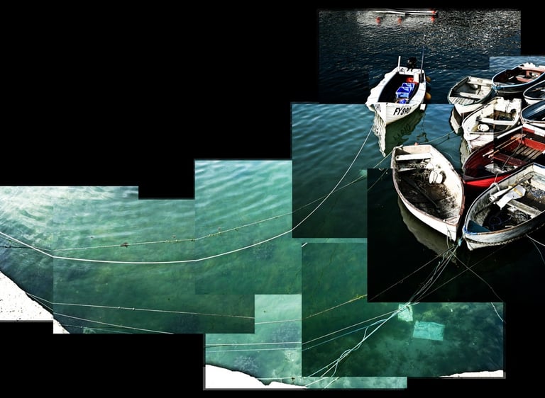 A photo joiner of small boats tied in a Cornish harbour