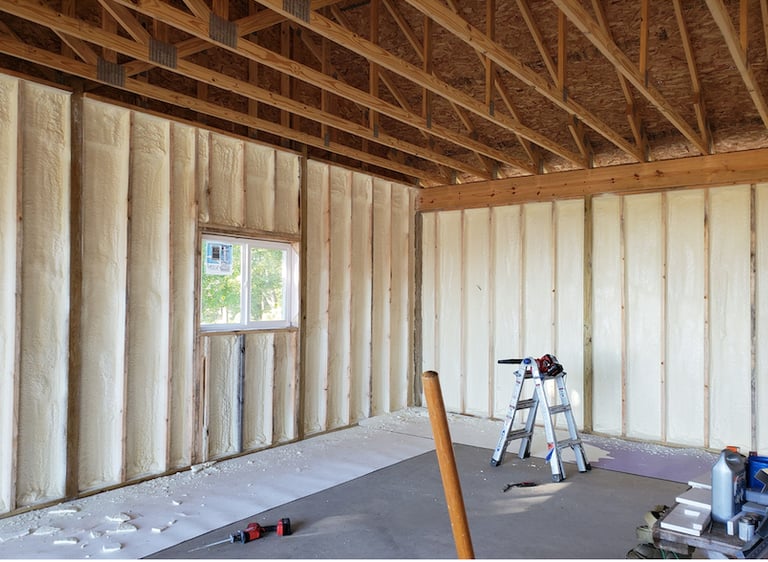 spray foam insulation inside of a house in lakewood, colorado