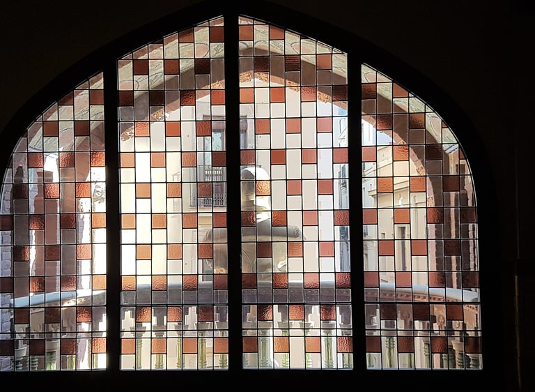 a window with a clock and a clock tower