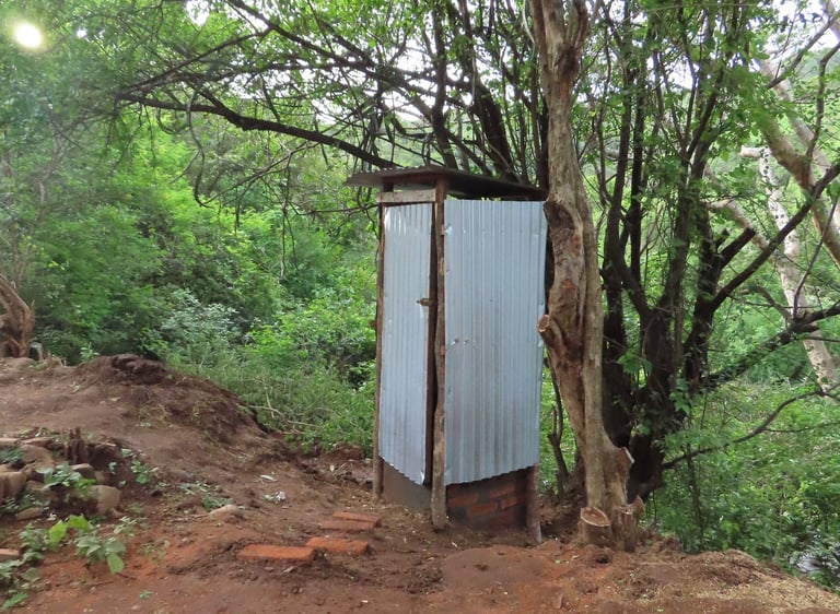 Outhouse in remote landscape used to increase hygiene and sanitation.