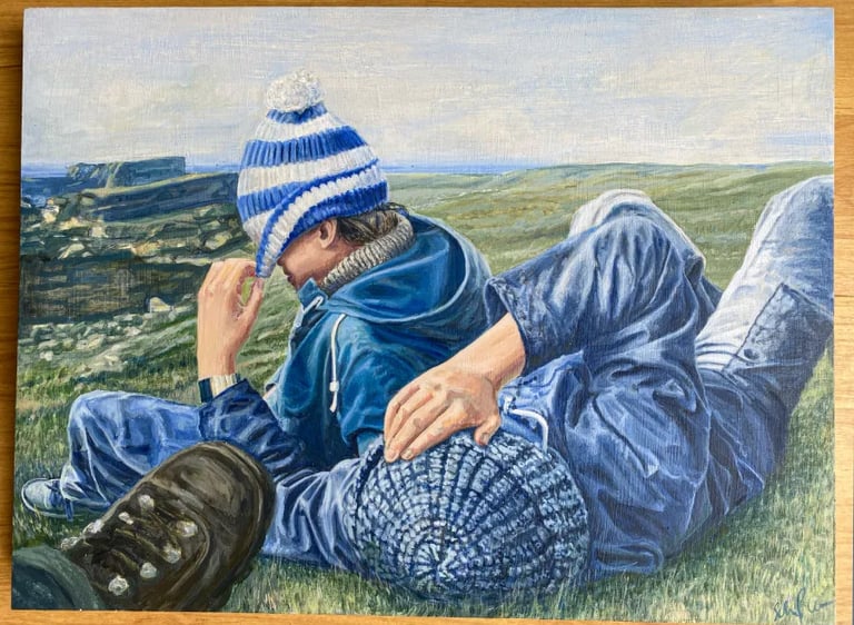 Oil portrait of two brothers lying on grass, painted in honour of brotherhood, memory and love