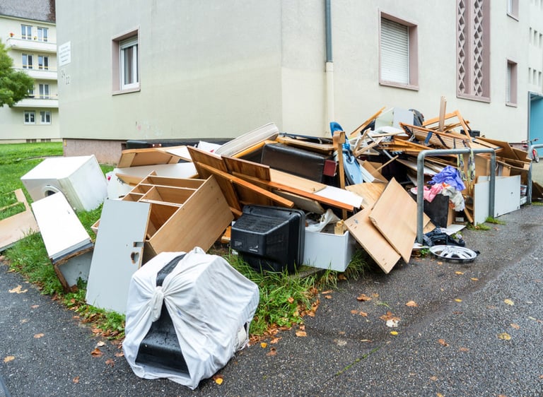 junk piled along driveway