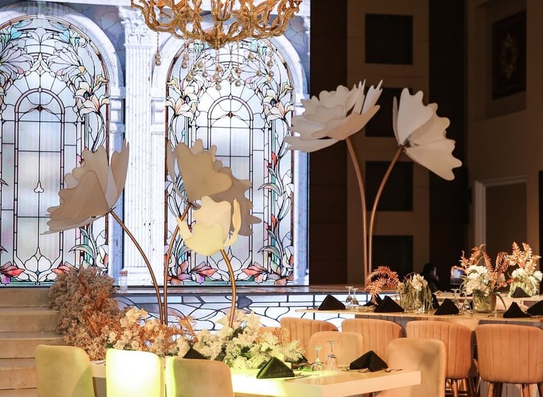 a large table in the front with a led screen in the back of an arches and stained glass