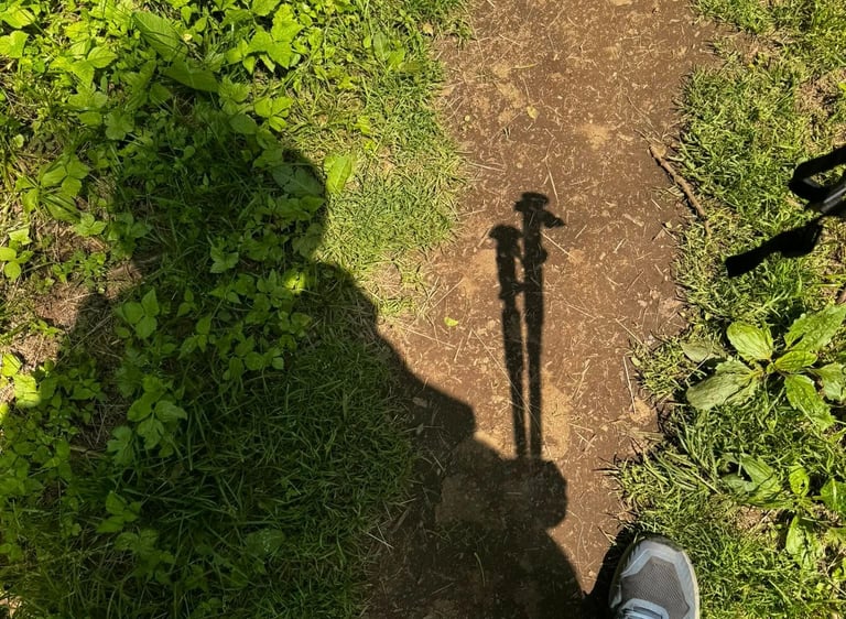 Sponge's shadow is pictured, complete with his hat and hiking poles visible.