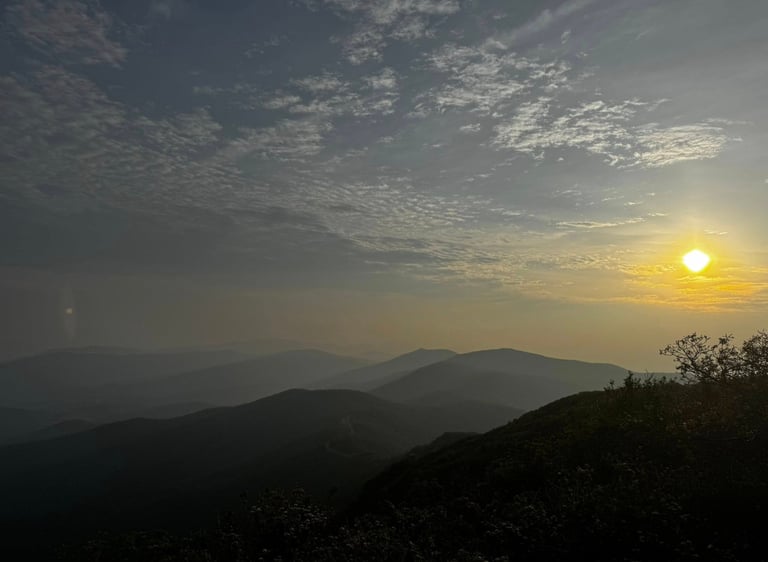 A sunrise view of Shenandoah's cool mountains is pictured.