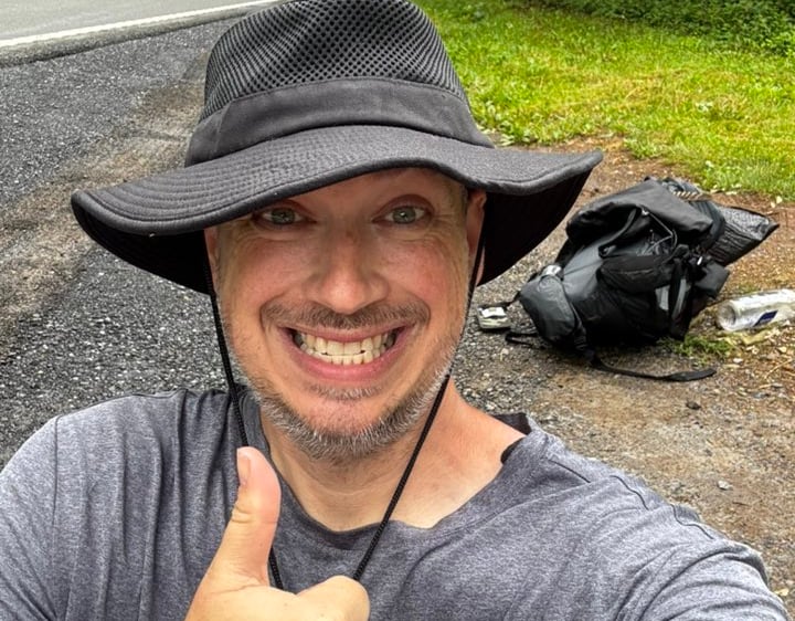Sponge, grinning like a spider monkey, shortly after taking a selfie at end of his AT trip.