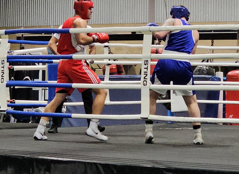 Athletes in a ring during a bout.