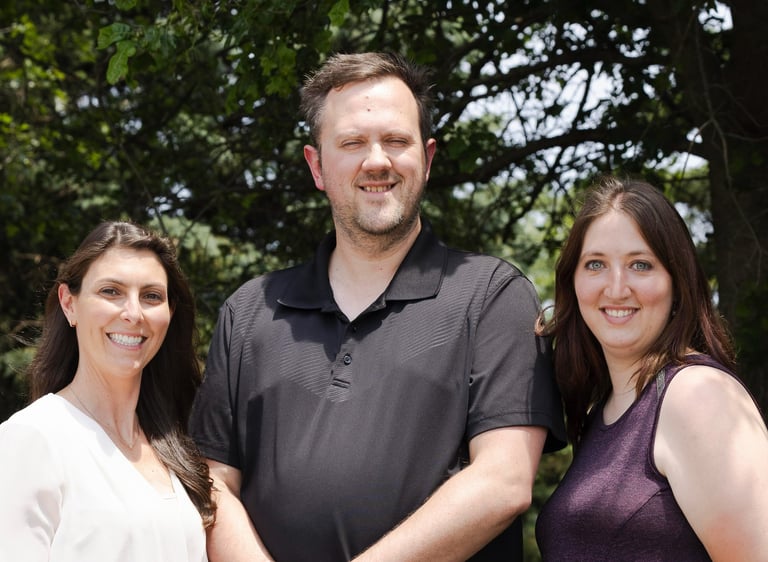 3 therapists looking toward the camera