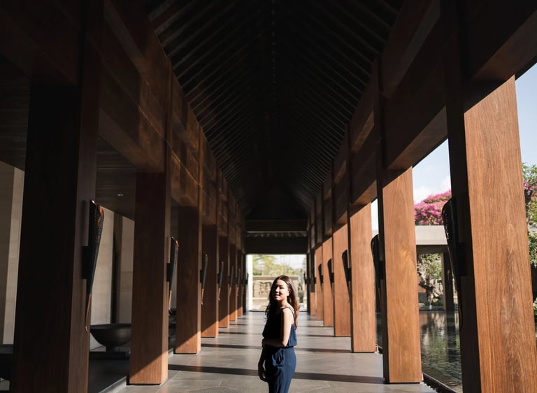 woman walking through kempinski bali corridor nusa dua
