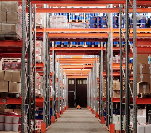 a warehouse style warehouse with a lot of shelves and boxes of boxes