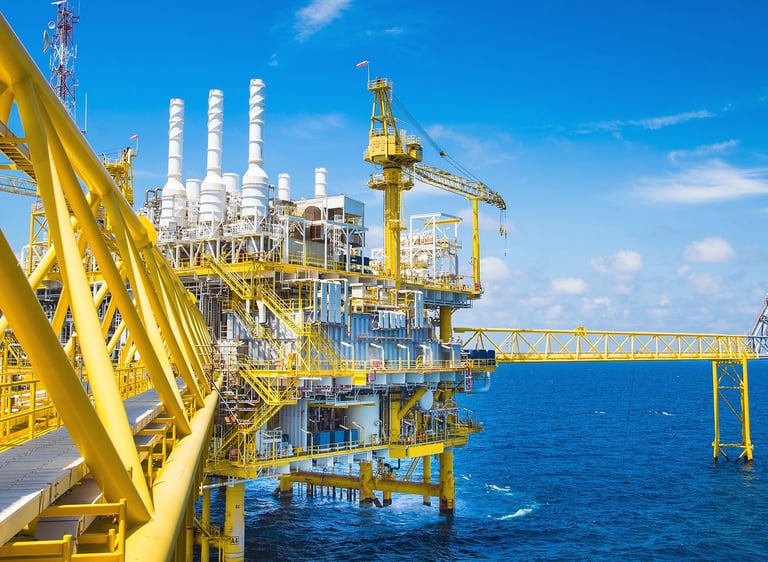 a large oil riget in the middle of a large body of water