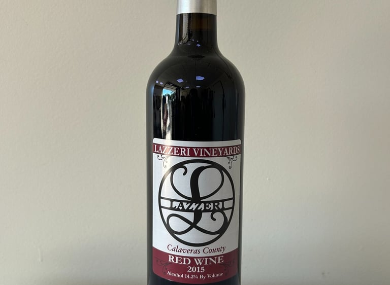 A close up picture of a wine bottle labeled 2015 Red Wine