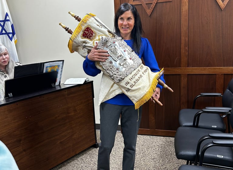 holding a torah