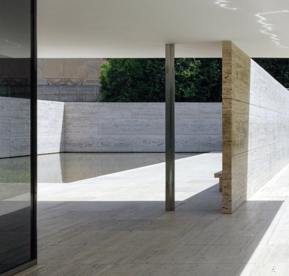 a large open space with a concrete wall and a concrete wall