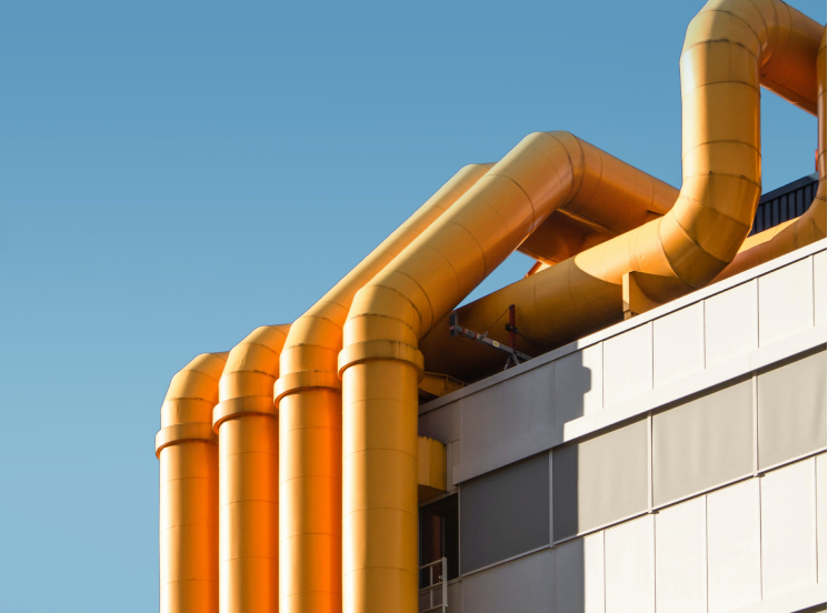 a large yellow pipework on a building