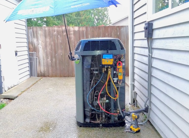 An outdoor HVAC system maintenance during a visit to our client making readings on the digital tool