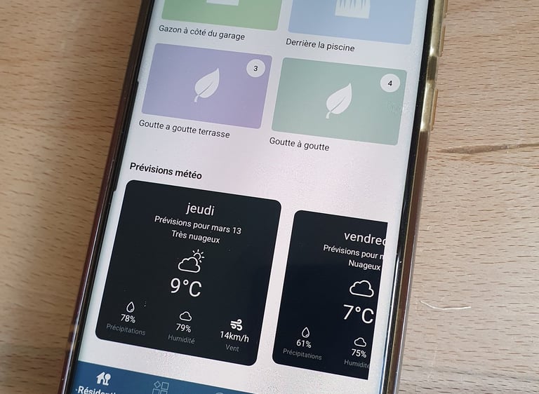a phone with a phone showing a weather station