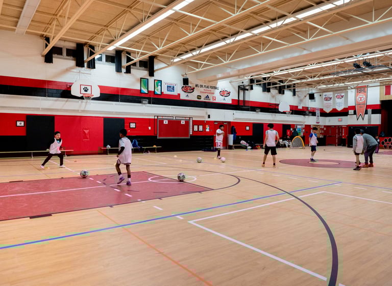 Young soccer MVB FC students practicing soccer drills indoor in MIssissauga
