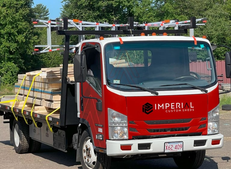 Shed on flatbed truck ready for on-site delivery and setup by Imperial Custom Sheds