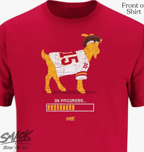 a goat in a red shirt with a goat in the middle of it