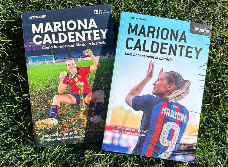 two books on the grass with a soccer player