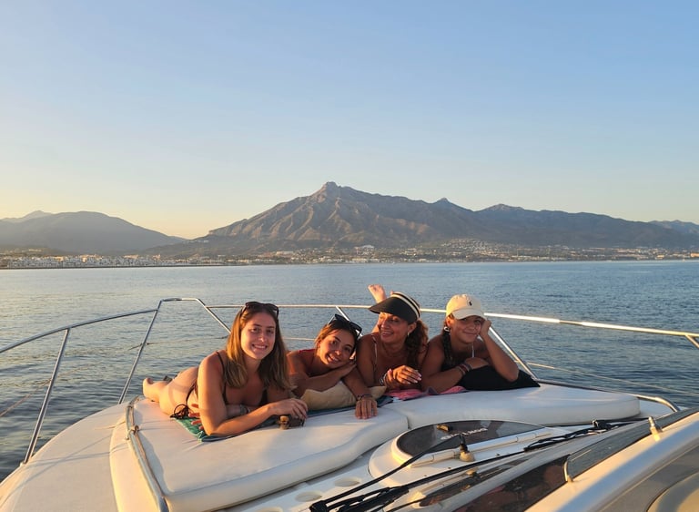 three girls on a boat in the ocean