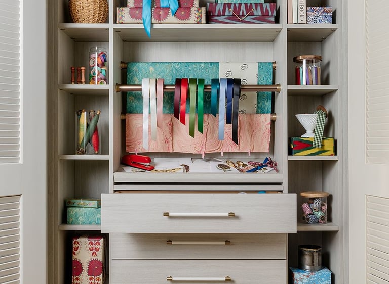 a closet with a shelf full of books and a toy