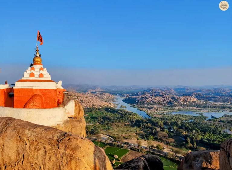 Lord Hanuman Temple on Anjanadri Hill overlooking the Tungabhadra River and Hampi’s boulder-strewn landscape.