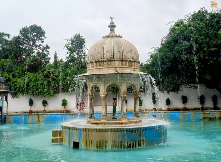 Fountain courtyard surrounded by greenery at the royal Saheliyon ki Bari in Udaipur Rajasthan