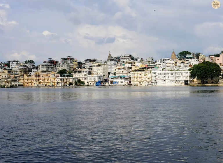 Traditional Udaipur havelis and temples lining the banks of Lake Pichhola, viewed from Ambrai Ghat Udaipur.