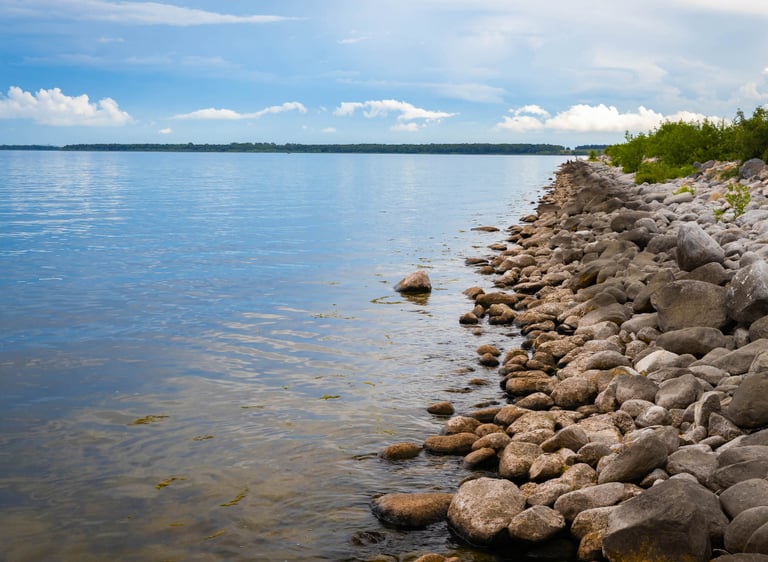 Riprap shoreline restoration and sand beach installation.