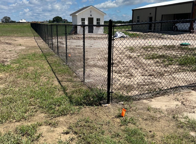 Black Metal Fence in a Backyard