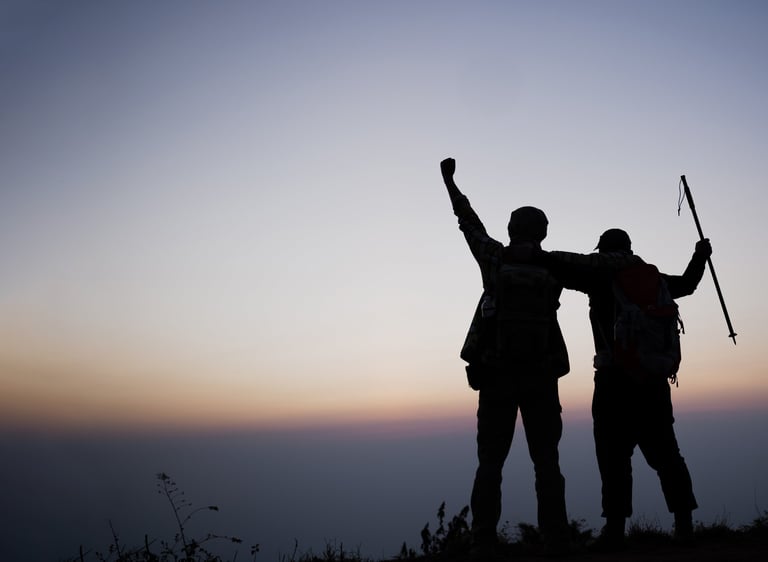 Men engaging in practical mentorship and celebrating successes at Men’s Foundry