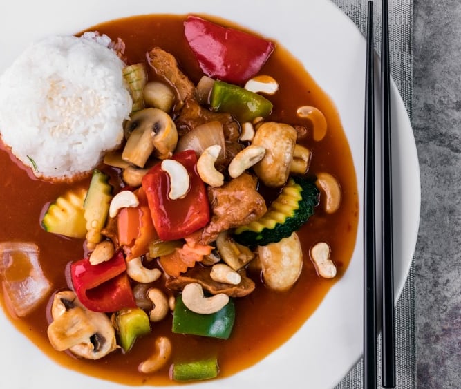 a plate of food with chopsticks