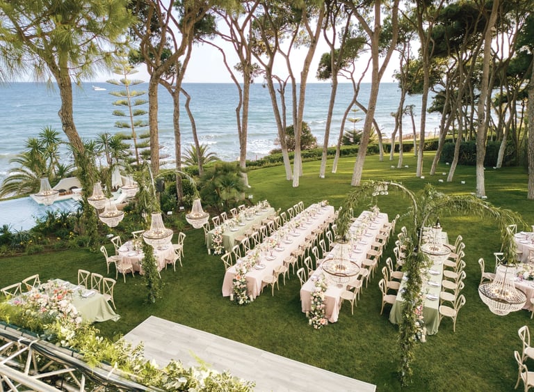 Aerial view of beachfront gala dinner setup in Marbella
