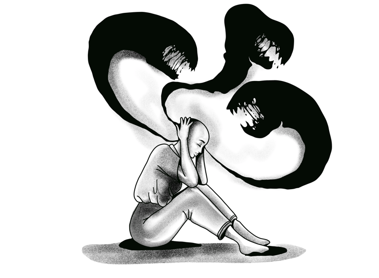 a woman sitting with her hand on her head