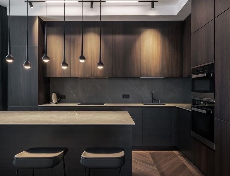 a kitchen with a large island and a bar stool