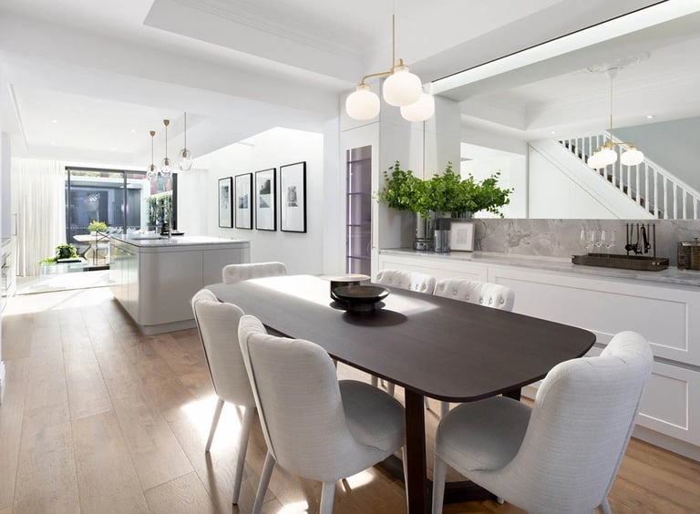 Heritage-meets-modern dining area, featuring organic curves and a cohesive material narrative.