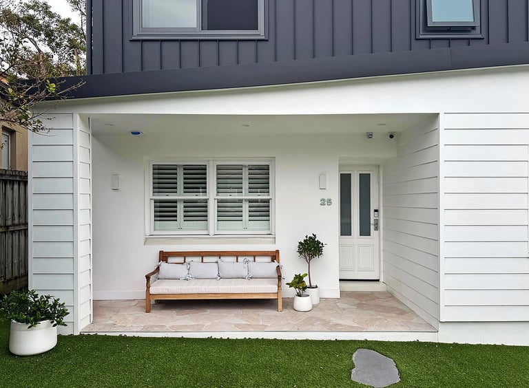 Architect-designed family home featuring a bold Hampton Brutalist exterior with matte black and white contrast.