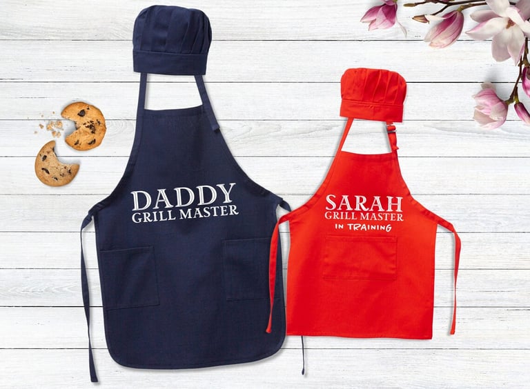 a couple of aprons with a cookie cookie and cookie