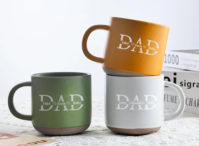 a couple of mugs with dad written word