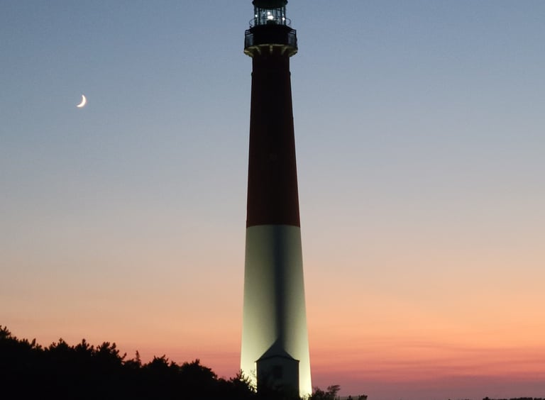 Picture of Barnegat Light House  at sunset with a crescent moon