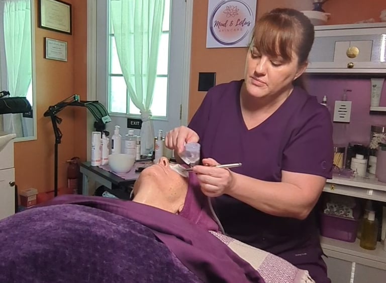 licensed esthetician performing oxygen infusion facial on client