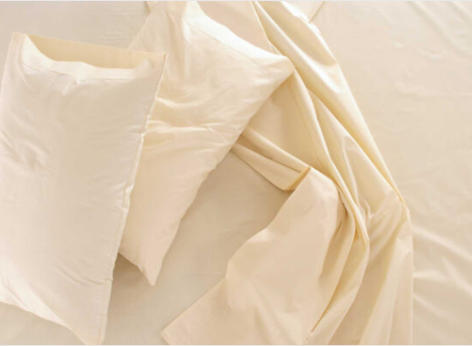 ivory 100% organic cotton sateen sheet set by Sleep and Beyond.