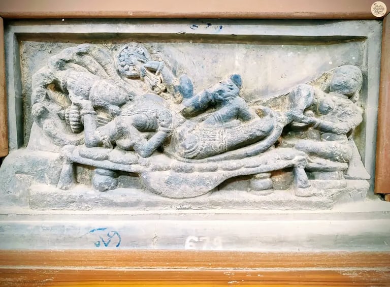 Intricate sculpture of Lord Vishnu resting on serpent Sheshnaga, attended by Goddess Lakshmi. 