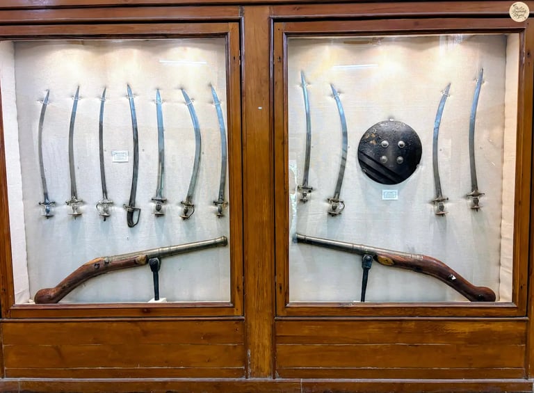 Historic weapons collection — swords, katars, and shields — at Bundi Government Museum.