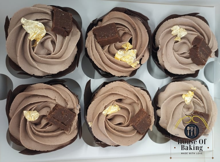 Chocolate cupcakes with hazelnut flavoured buttercream, a piece of homemade hazelnut nougat