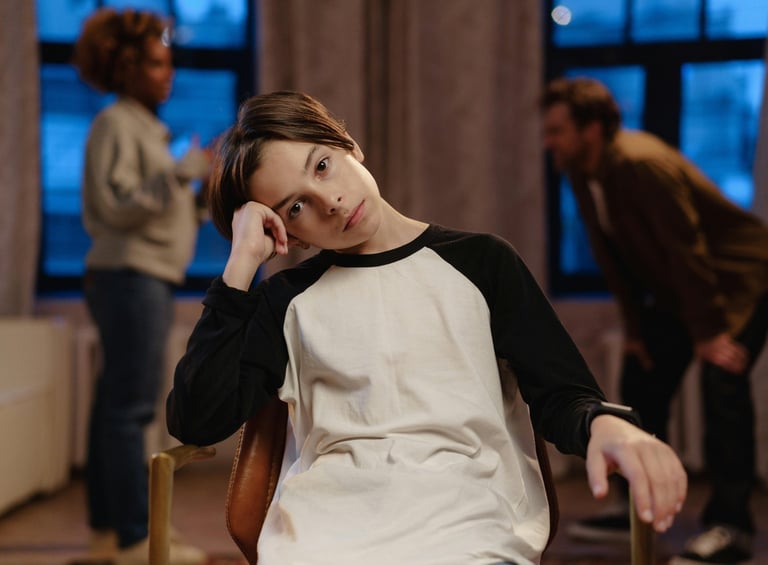 a woman sitting in a chair with a man in a chair